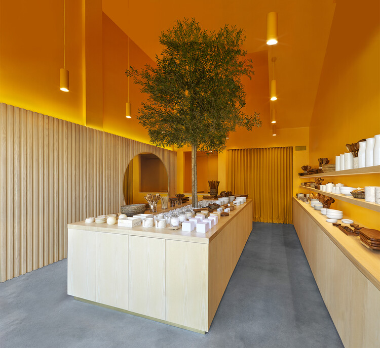 Retail store with warm golden paint colors and wood accents by an interior painter in Silver Spring, MD